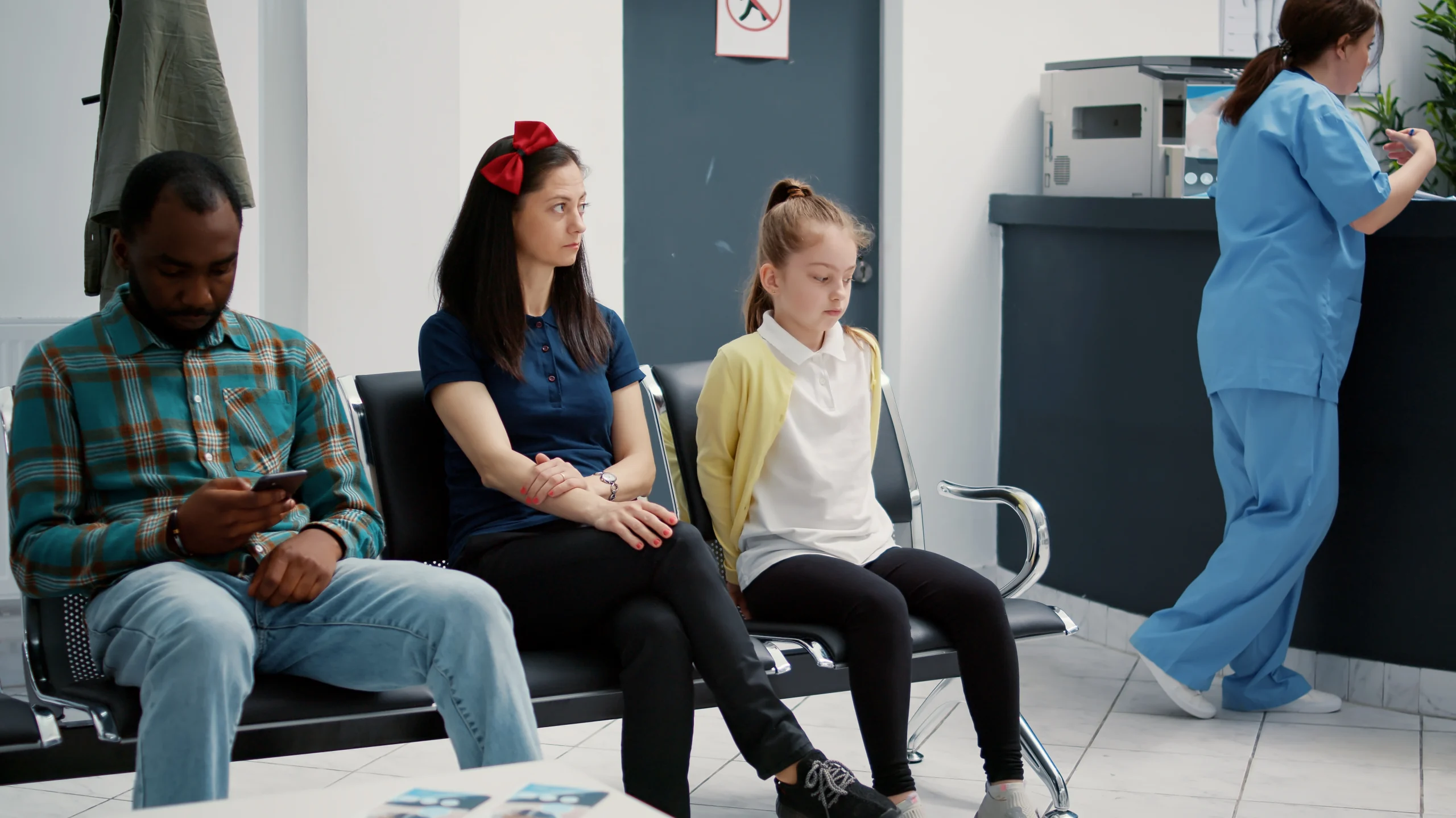 portrait-young-mother-with-little-girl-sitting-hospital-reception-lobby-attend-medical-consultation-with-appointment-waiting-room-area-healthcare-clinic-checkup-examination
