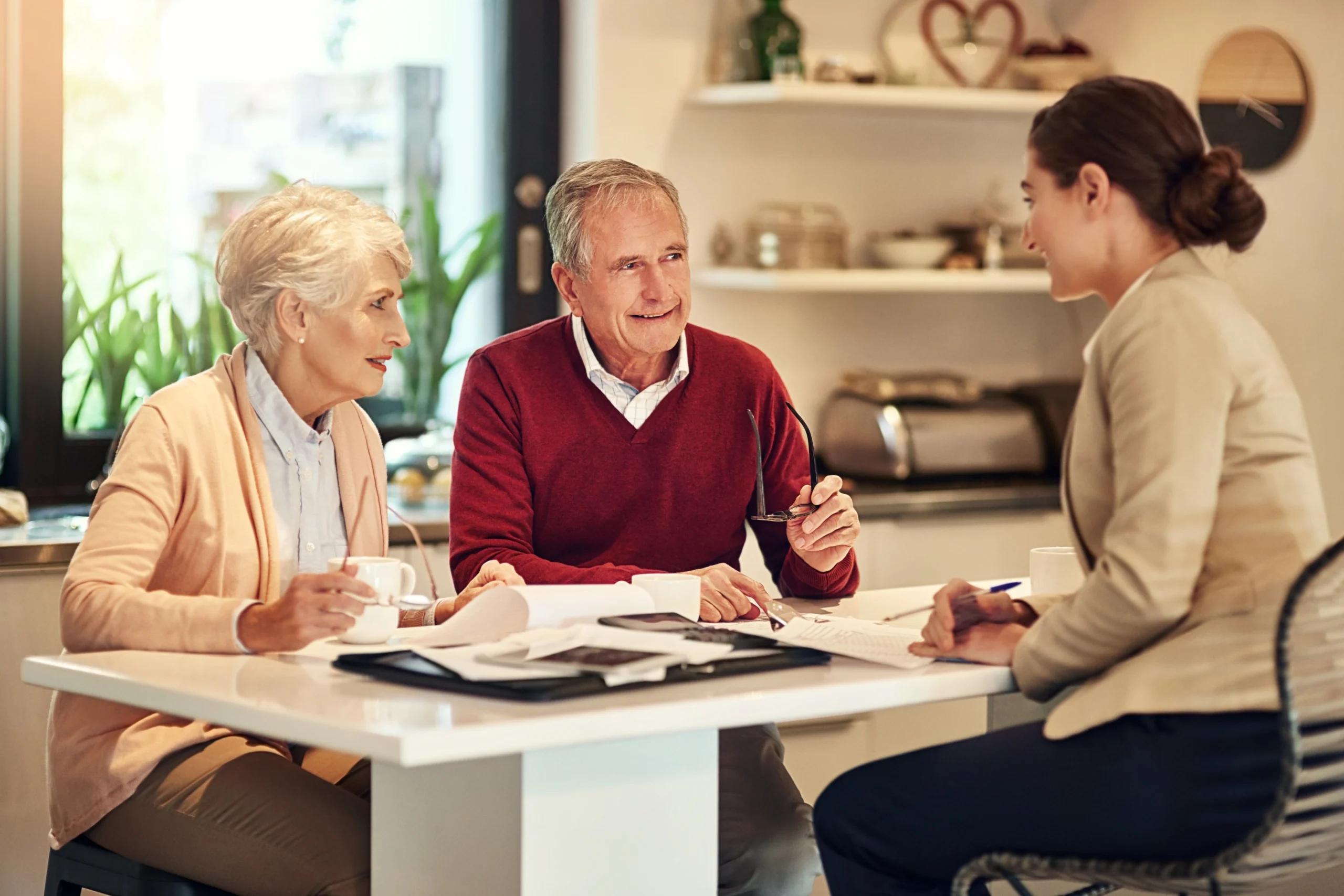 senior-couple-financial-advisor-documents-retirement-plan-budget-expenses-bills-home-elderly-man-woman-finance-discussion-with-consultant-lawyer-paperwork-loan