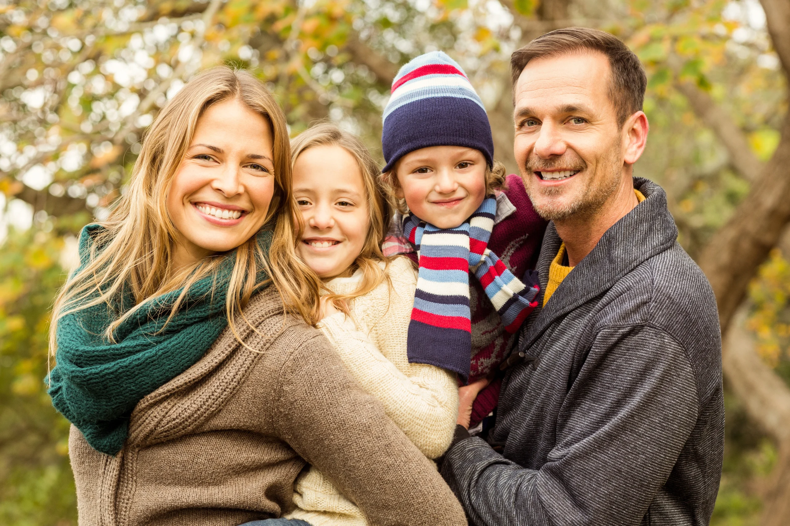 smiling-young-family-posing-together