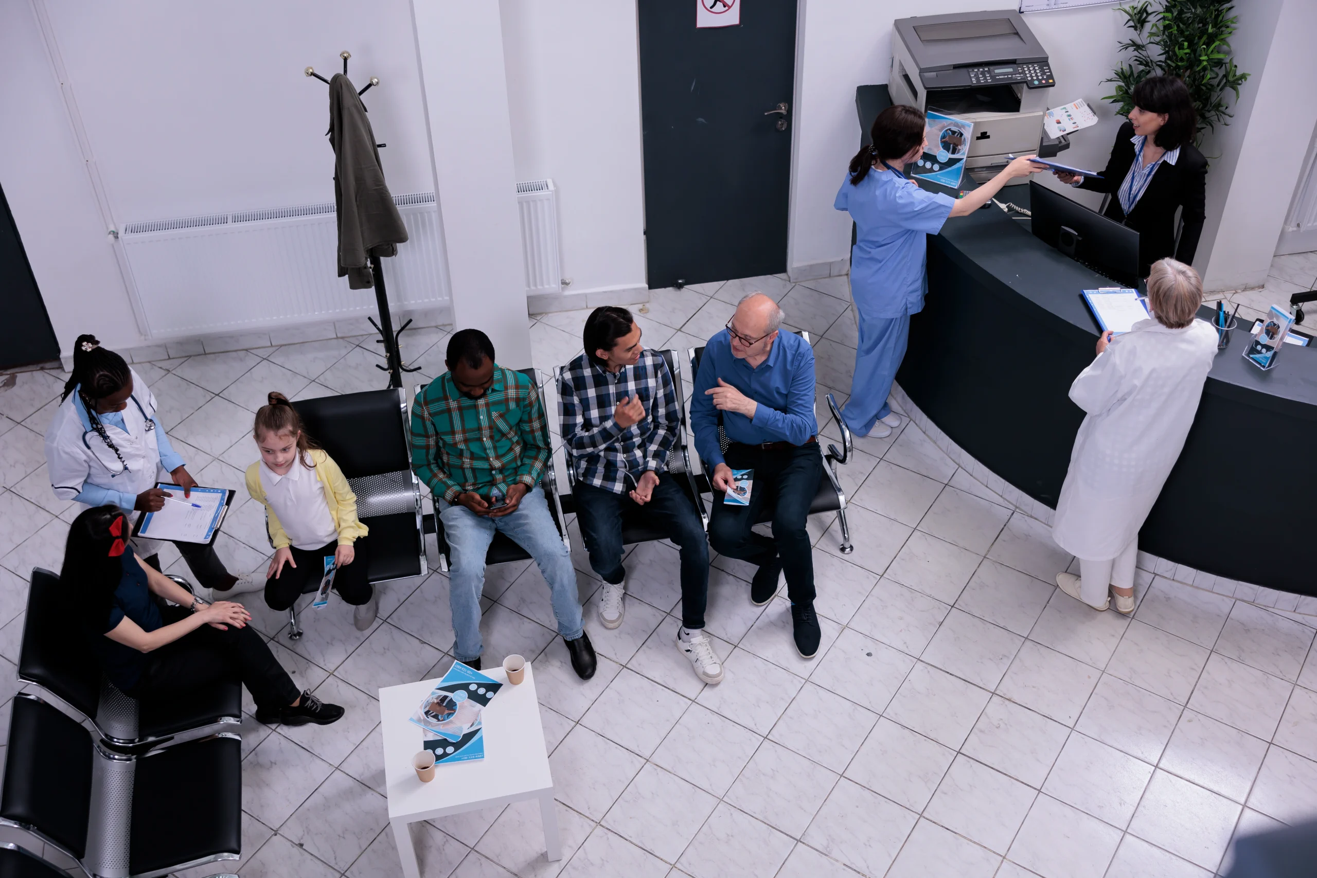 top-view-hospital-reception-diverse-group-people-waiting-doctor-appointment-while-talking-about-medical-problems-professional-nurse-checking-appointment-mother-child