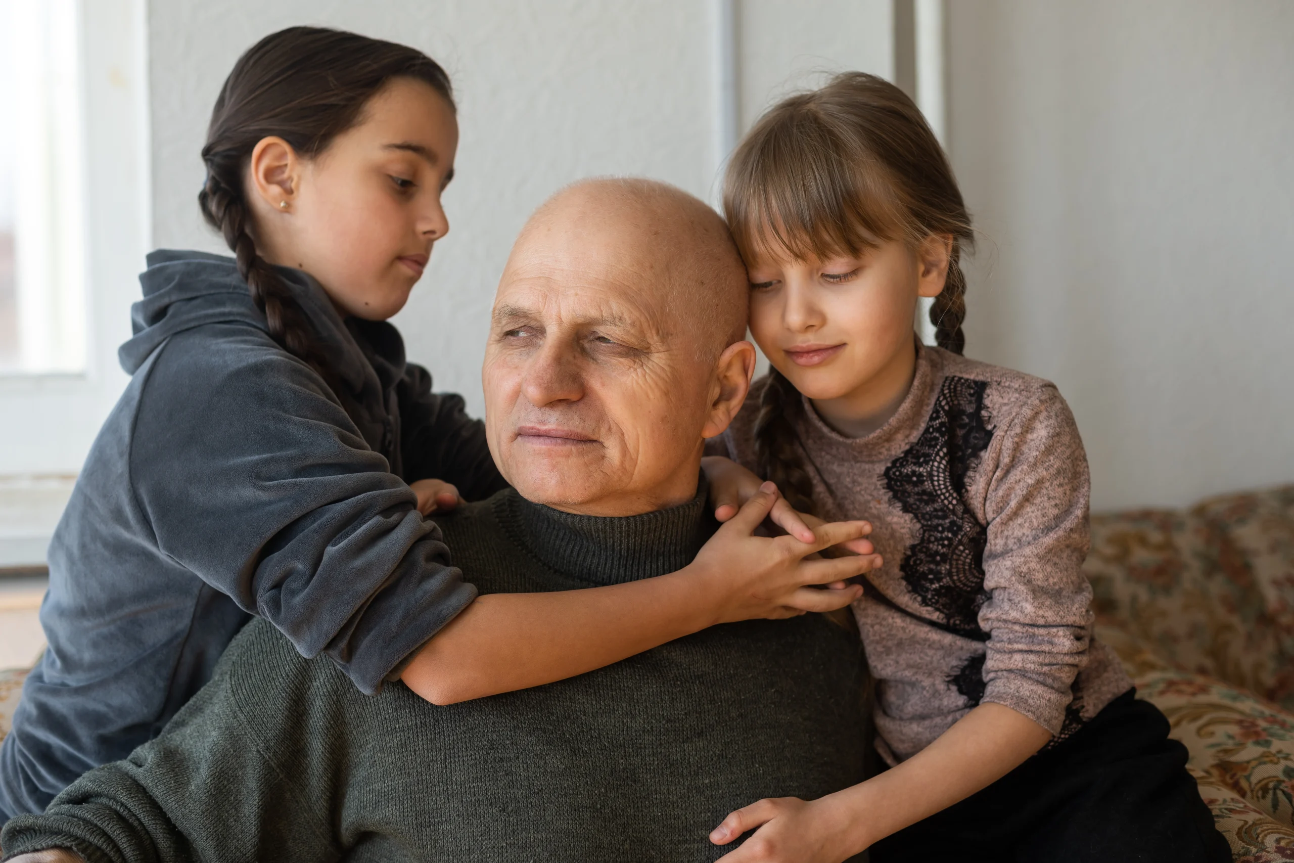 ukrainian-grandfather-two-granddaughters-hugging