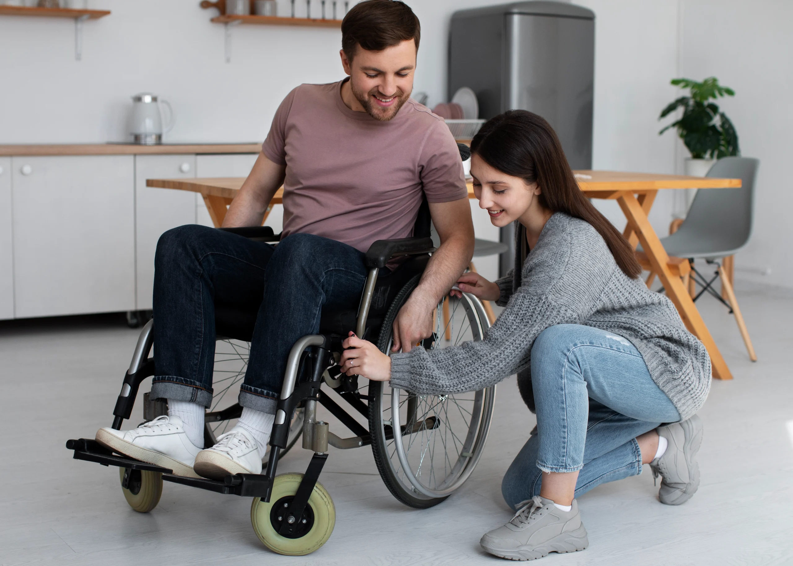 young-adult-helping-disabled-friend